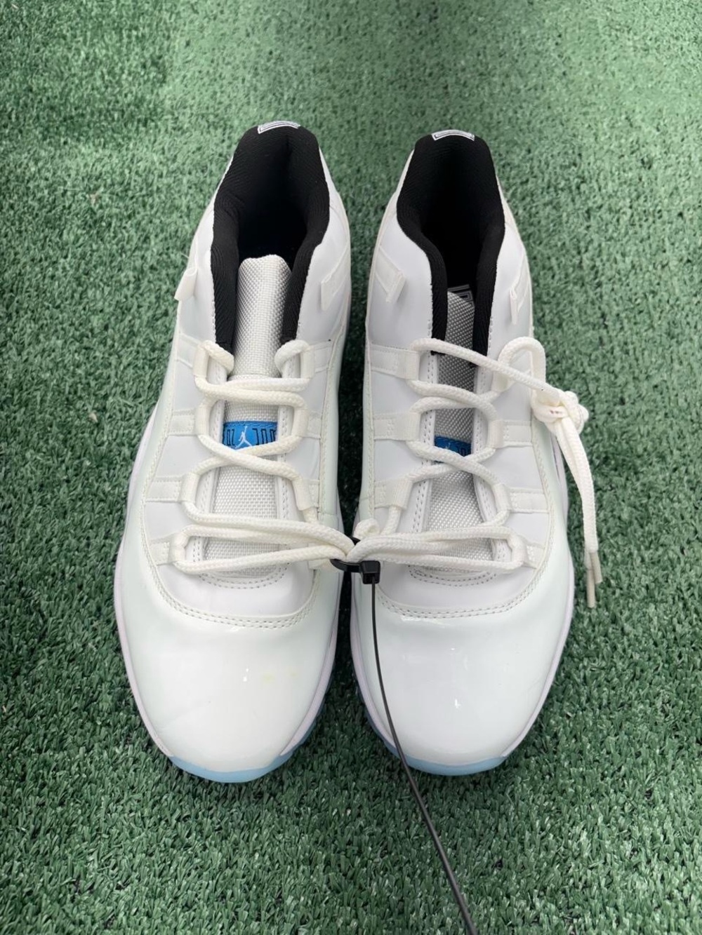 Jordan Men's White Athletic Shoes with Black Interior and Light Blue Accents